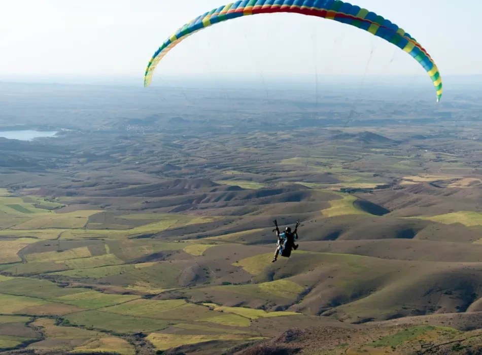 Tandem Paraglider in Sky