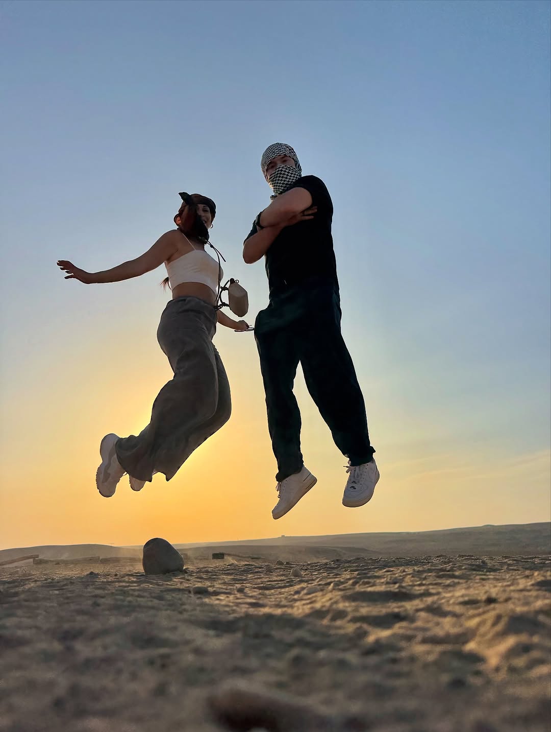 Couple enjoying the desert at sunset